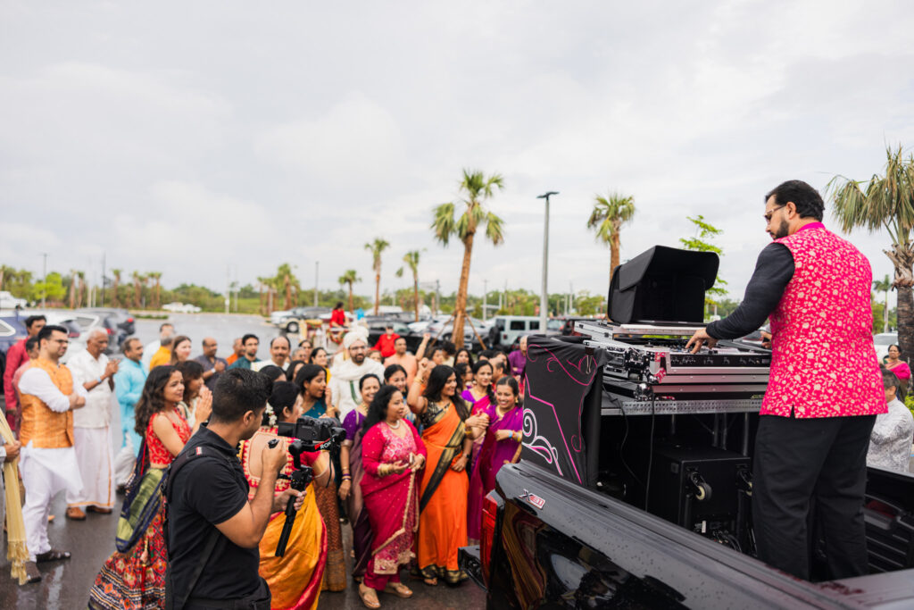 Indian Baraat DJ, DJ Pram man's his incredible sound system and makes the crowd roar.